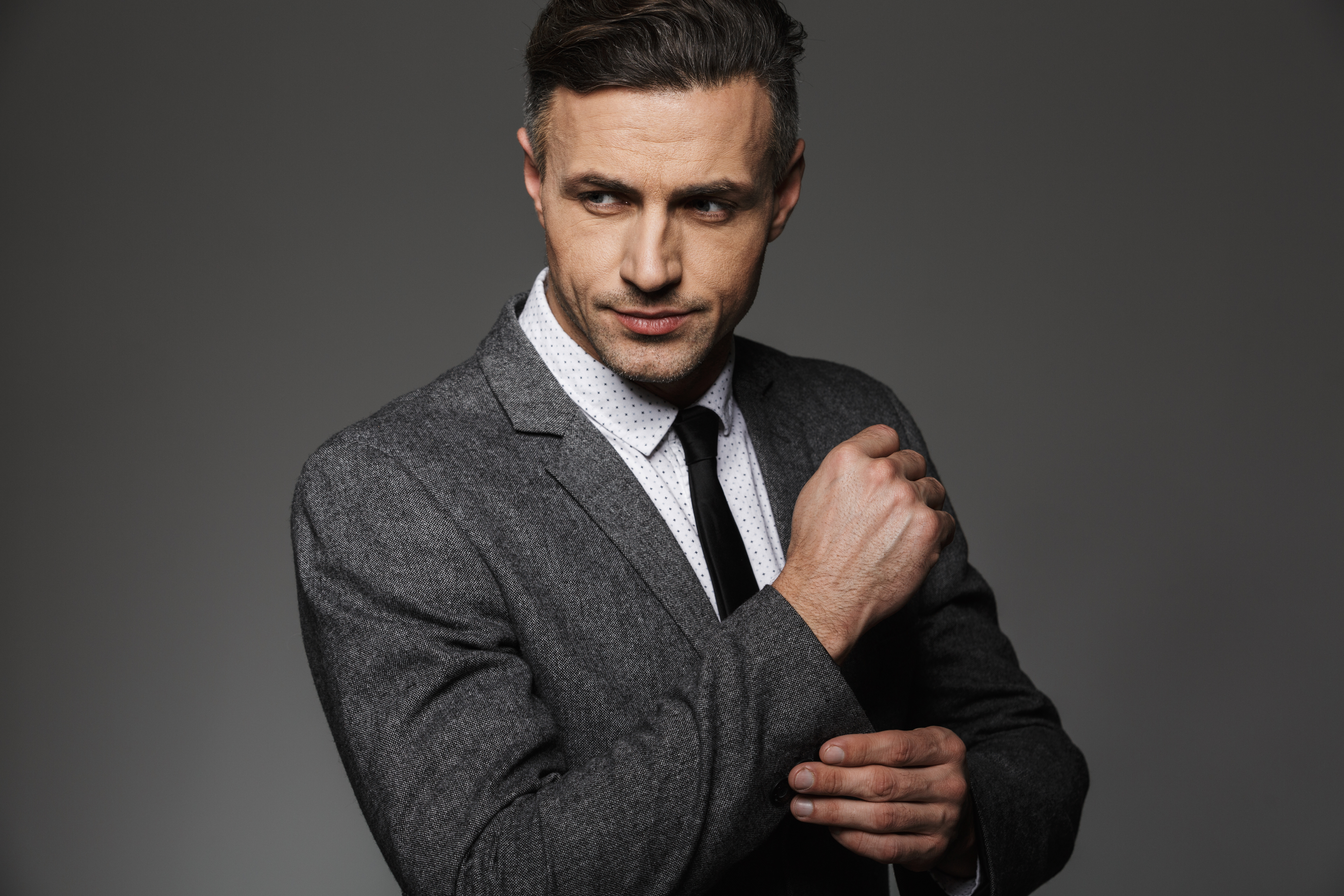 photo of stylish man wearing business suit