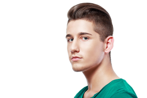 A Photo For A Blog Post About How Is A Non-Surgical Rhinoplasty Done? Picture of a young man with three quarters profile on white background